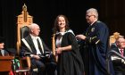 A graduate on stage during the ceremony. All images: Darrell Benns/DC Thomson