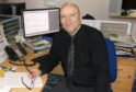 Neil Macphail at his desk in The P&J office in Inverness in 2015. Image: DC Thomson