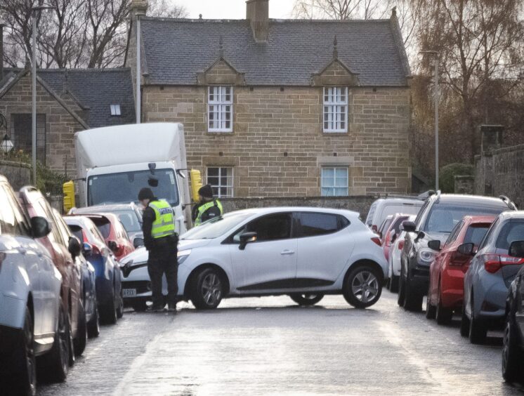 Police at the scene of a car crash on Queen Street due to icy conditions