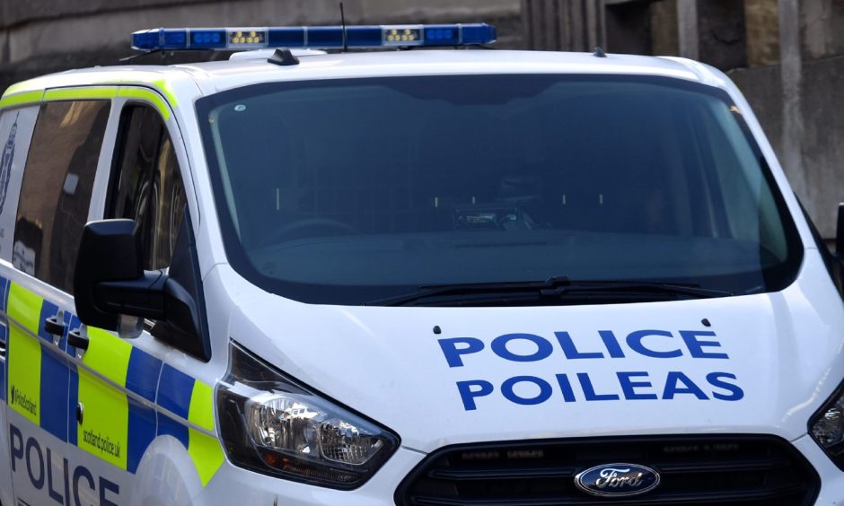 Police van with police written on the bonnet.