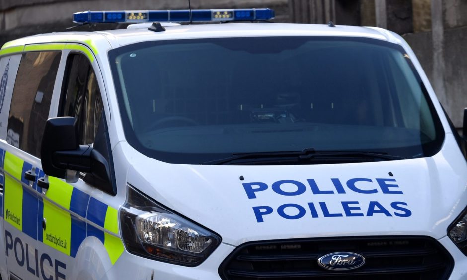 Police van with Police written in blue across the bonnet of the van.