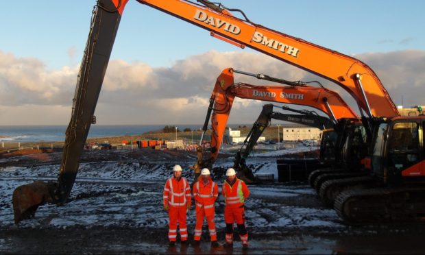 Jamie Wallace, Alan McWilliam and David Smith at the EGL2 HVDC converter station site.