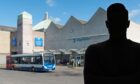 Silhoutted figure at Elgin bus station.