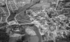 1979: In this aerial view of Ellon - with the River Ythan curving on the left (note the old and modern bridges) - part of the old town is to be seen on the right, with the newest development at Meiklemill top left. Image: DC Thomson