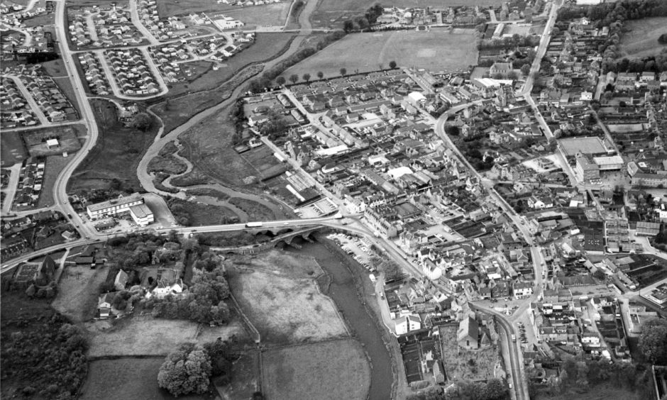 1979: In this aerial view of Ellon - with the River Ythan curving on the left (note the old and modern bridges) - part of the old town is to be seen on the right, with the newest development at Meiklemill top left. Image: DC Thomson