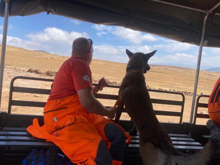 Gary and Corrie look out from a truck in Morocco. Image: Scottish Fire and Rescue Service.