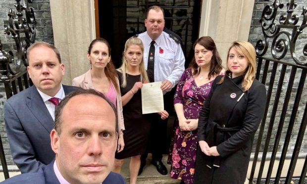 Harriet Cross MP holding letter to the chancellor as she and fellow signatories deliver it to Downing Street in London. Image: Scottish Conservatives