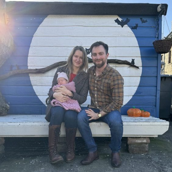 Tatiana Shingurova and Greg Stewart with their young child.