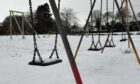 A play park in Inverness now under the cover of snow. Image: Will Angus/DCT Media.