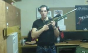 Skye shooter Finlay MacDonald poses with a gun.