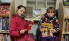 Insch Library users Isobel and Evie will be sad to see the venue close. Image: Kirstie Topp/DC Thomson