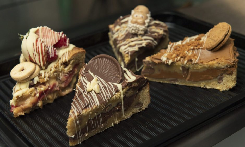 Close up of four slices of cake. 