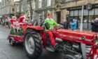 Mr and Mrs Claus on a festive tractor. Image: Jason Hedges/DC Thomson