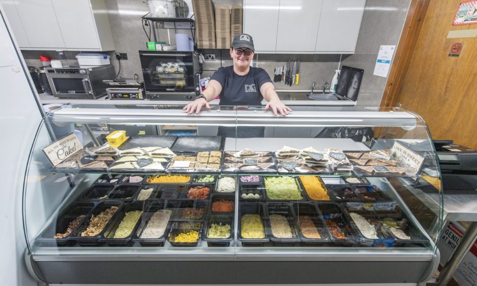 Kathleen Shanks behind Little Lunchbox counter. 