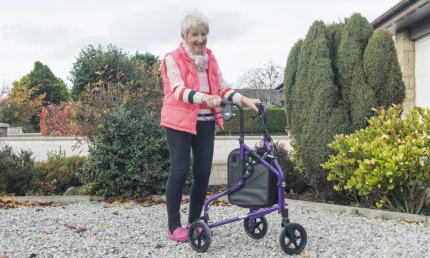 Liz with her walker at home in Nairn. She will embark on a walk around Cumbrae next year to mark her 80th birthday. Image: Jason Hedges/DC Thomson