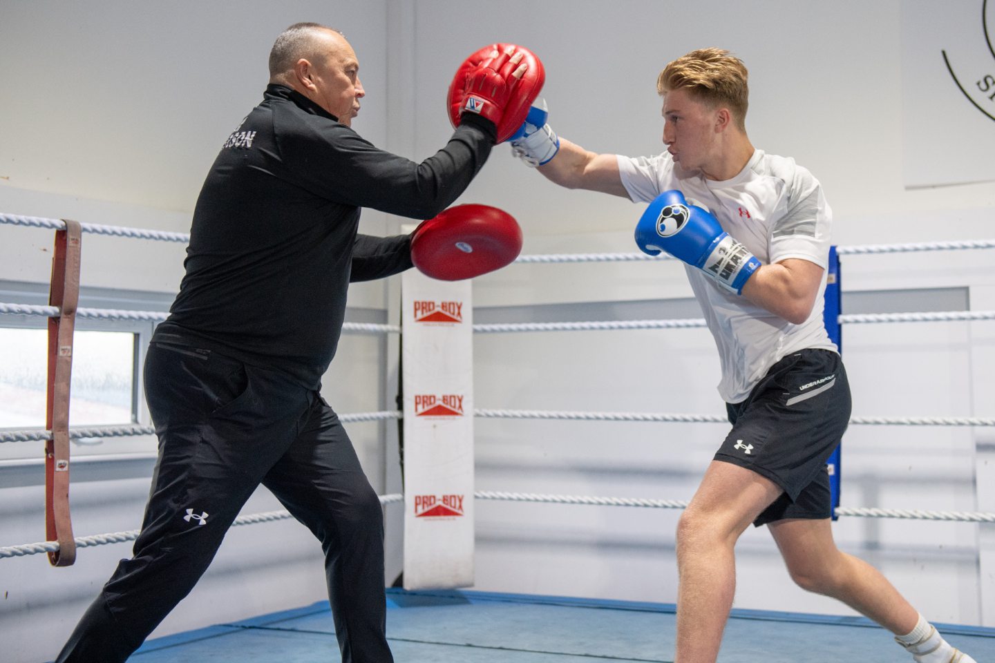 Aberdeen boxer Gregor McPherson doing pad work with father and trainer Tom. Image Kenny Elrick/DC Thomson