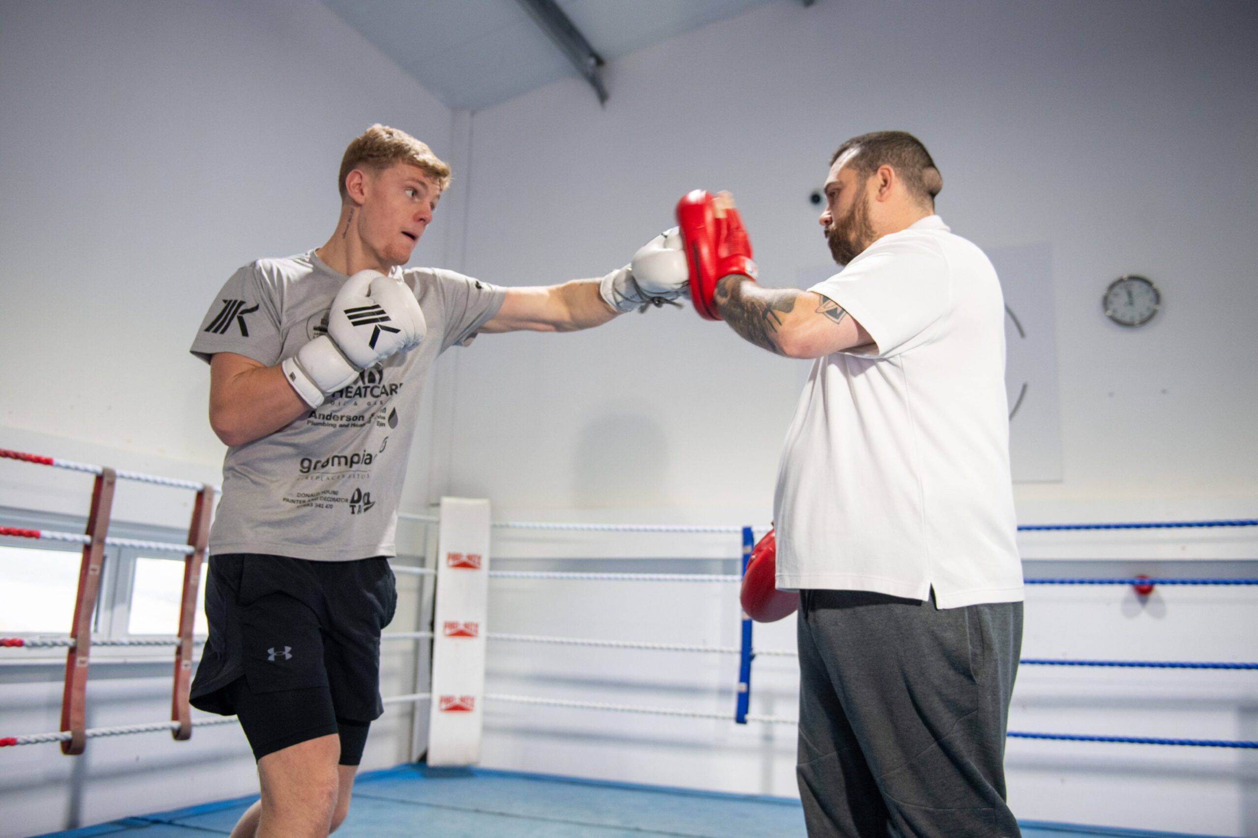 Boxer Fraser Wilkinson doing pad work with trainer David McAllister. Image: Kenny Elrick/DC Thomson