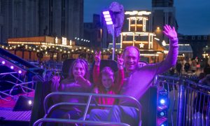 Family on ride at Christmas Village