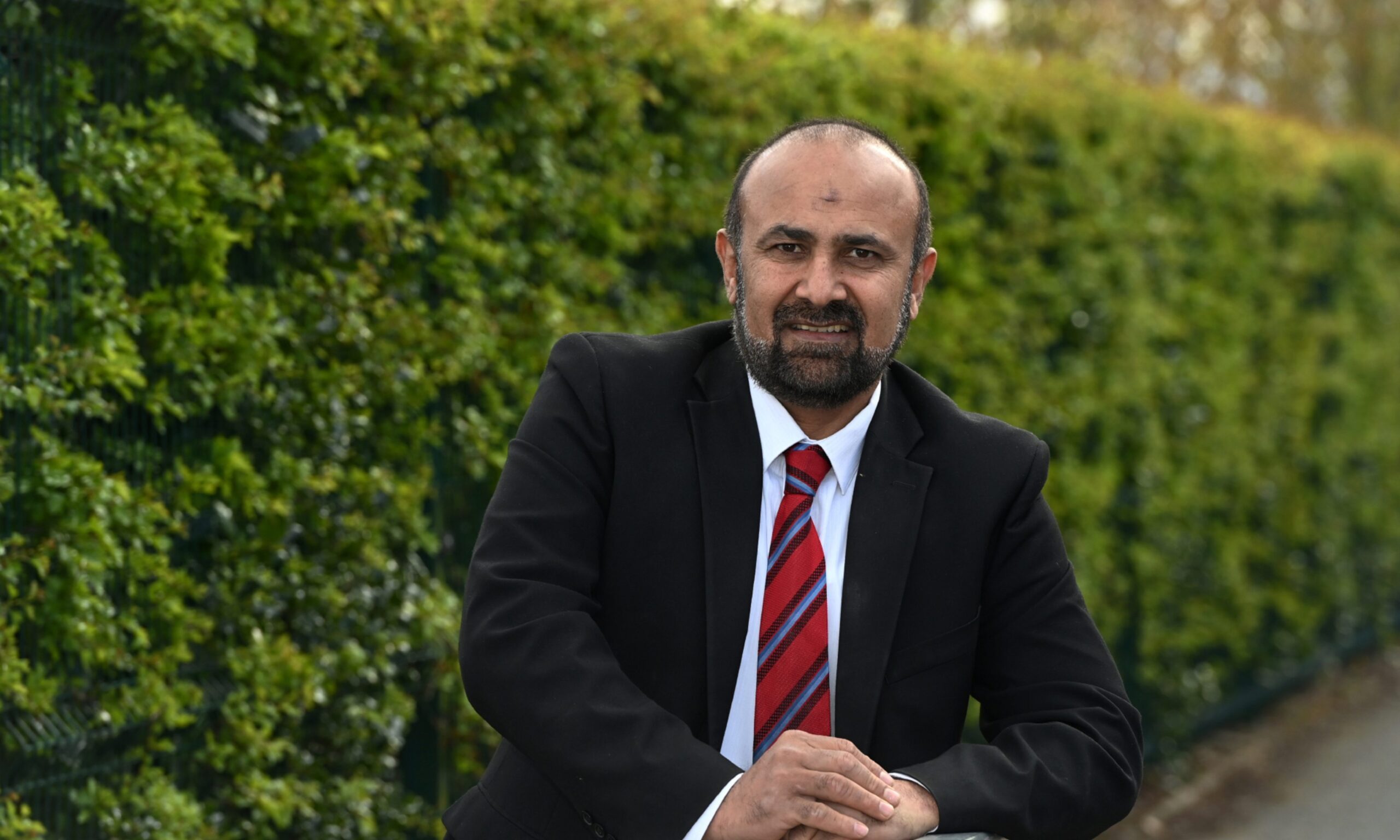 Labour councillor M. Tauqeer Malik pinched the legal advice and wave it in the council chambers at October's meeting. Image: Kenny Elrick/DC Thomson