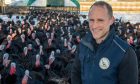 Craig Michie, who runs Barra Bronzes with his family near Inverurie, and his free-range turkeys. Image: Kenny Elrick/DC Thomson