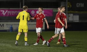 From left to right: Deveronvale's Ethan Hopkinson, Harry Noble, Jamie MacLellan and Jaydan Bradford (obscured) celebrate their Morrison Motors (Turriff) Aberdeenshire Shield win against Banks o' Dee. Pictures by Kenny Elrick/DCT Media.