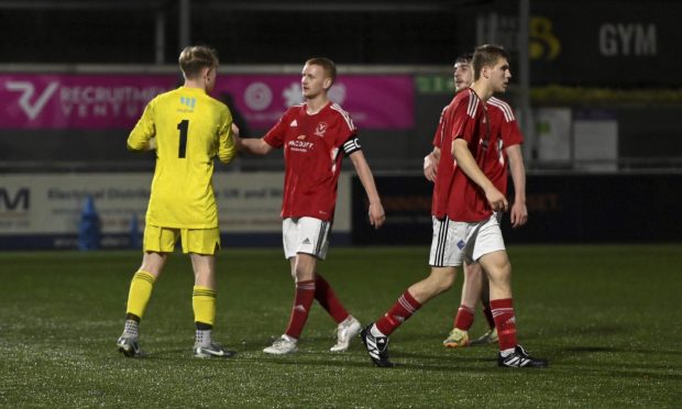 From left to right: Deveronvale's Ethan Hopkinson, Harry Noble, Jamie MacLellan and Jaydan Bradford (obscured) celebrate their Morrison Motors (Turriff) Aberdeenshire Shield win against Banks o' Dee. Pictures by Kenny Elrick/DCT Media.