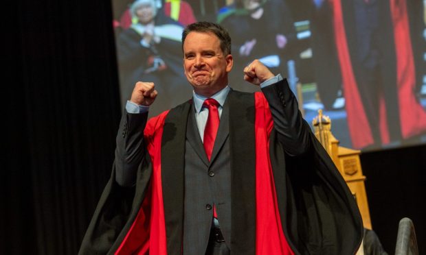 A graduate celebrating as he leaves the stage at Elphinstone Hall. All images: Kath Flannery/DC Thomson