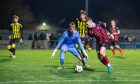 Inverurie Locos' Daniel Agnew, right, tries to evade Aberdeen goalkeeper Rodrigo Vitols. Pictures by Kami Thomson/DCT Media.