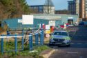 Police seal off a grassy area between Hanover Street and Castle Terrace. Images: Kami Thomson/DC Thomson