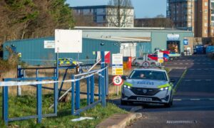 Police seal off a grassy area between Hanover Street and Castle Terrace. Images: Kami Thomson/DC Thomson