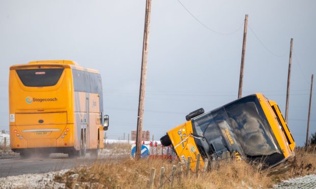 A Stagecoach bus has tipped over while driving along the A952 near Lonmay. Image: Kami Thomson/DC Thomson