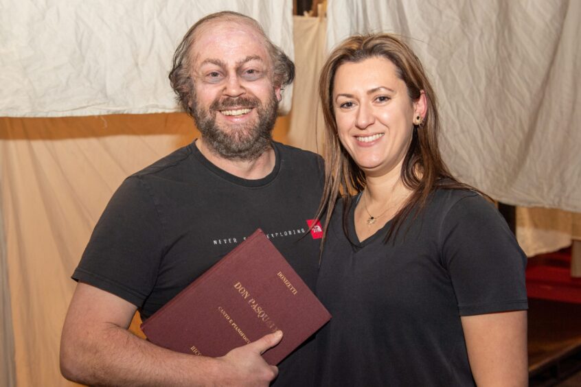 David Stout backstage with his hair and makeup done alongside his wife Susannah Wapshott conductor on the night 