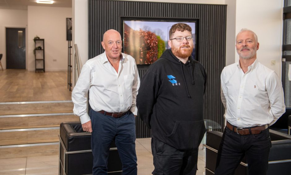 Hamish and John inside the plush lobby with building manager Steven Leask. Image: Kami Thomson/DC Thomson