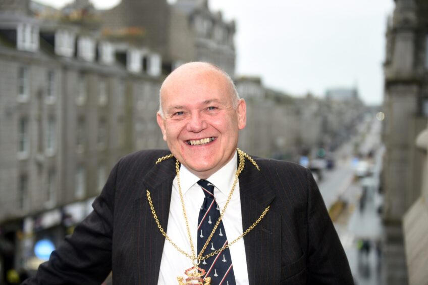 Councillor Barney Crockettt, when Lord Provost, on the Aberdeen Town House balcony beneath the clock tower. Image: Paul Glendell/DC Thomson