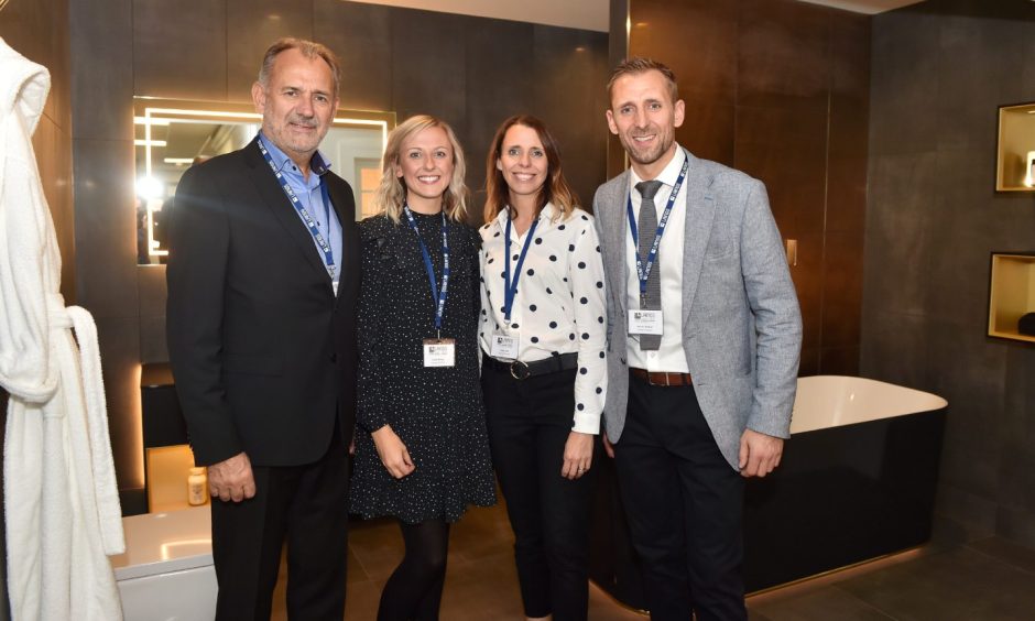 The trio pictured alongside their dad and former Managing Director of Laings Andy Walker. Image: Scott Baxter