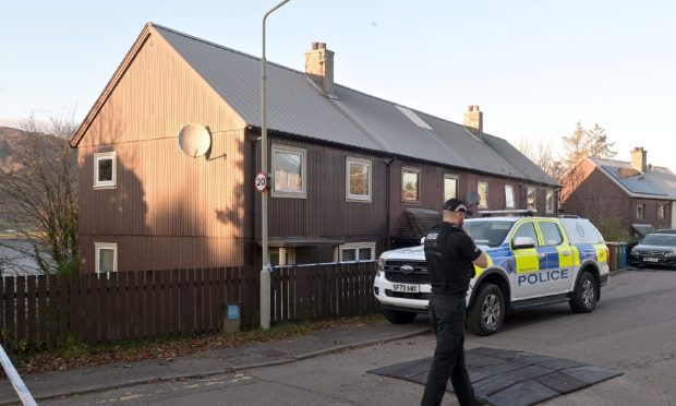 Police remain at the scene. Image: Sandy McCook/DC Thomson