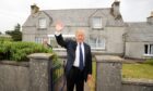 Tycoon Donald Trump at the house in Tong, on the Isle of Lewis, where Donald Trump's mother was brought up. Image: Andrew Milligan/PA Wire