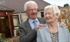 Hamish and Joan MacDonald in their garden