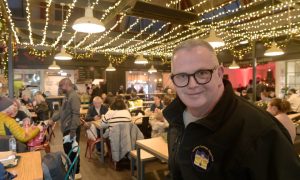 Market assistant manager Donald Hunter in the decorated food hall.
Image Sandy McCook/DC Thomson