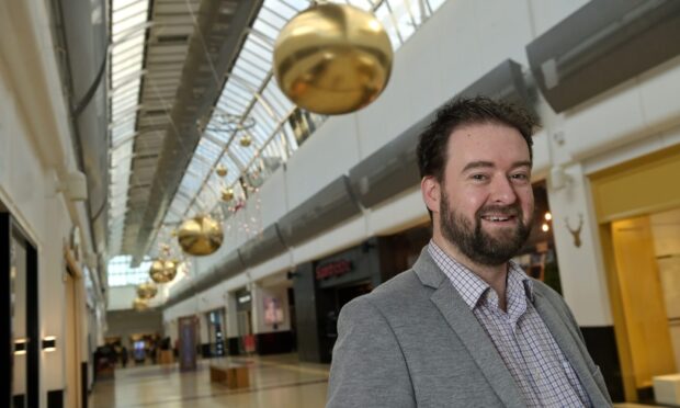 It's beginning to look a lot like Christmas  behind Eastgate Centre manager Chris Kershaw. Image: Sandy McCook/DC Thomson