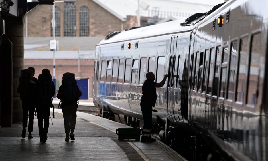 Passengers on the platform at Inverness station. 