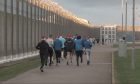 Inmates at HMP Grampian are put through their paces around the prison walls. Image: Paolo Maccagno