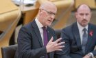 John Swinney was urged to speed up the dualling of the A9 at First Minister's Questions at Holyrood on Thursday. Image: PA.