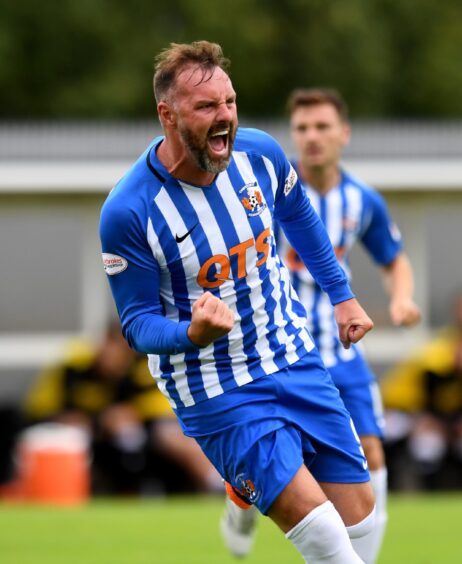 Kris Boyd celebrates scoring for Kilmarnock against Dumbarton in the Betfred Cup in August 2018. Striker Boyd scored a hat-trick that day in a 4-2 win.