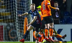 Jamie Lindsay celebrates a dramatic stoppage time equaliser against Dundee United, on Ross County's route to the Championship title in 2019. Image: SNS