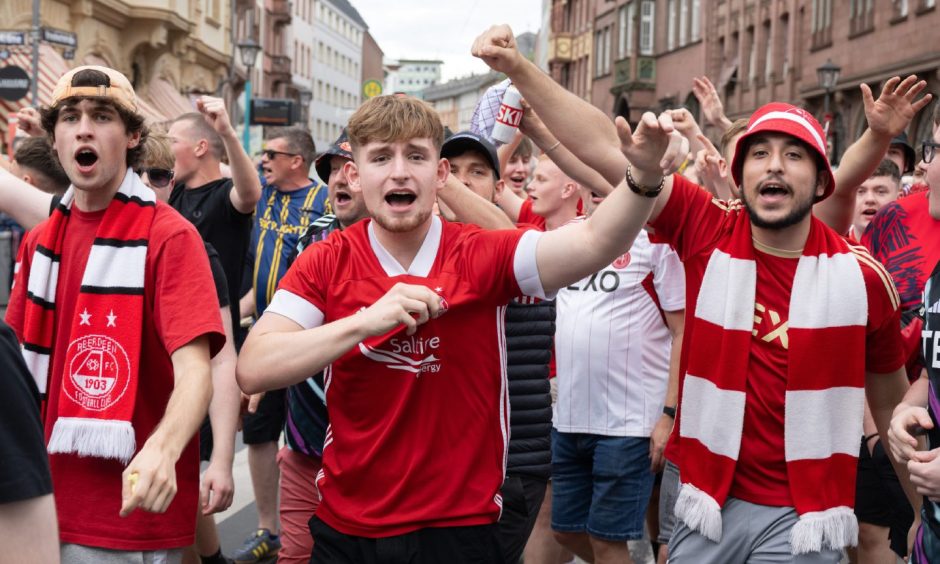 Dons fans have already been praised for the boost they have given the city centre this season. Image: PA Wire via DPA.