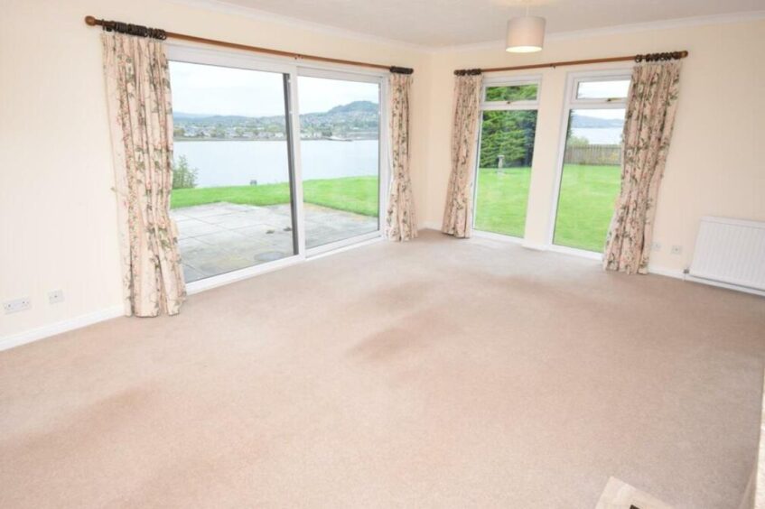 Large patio doors and window from sitting room. 