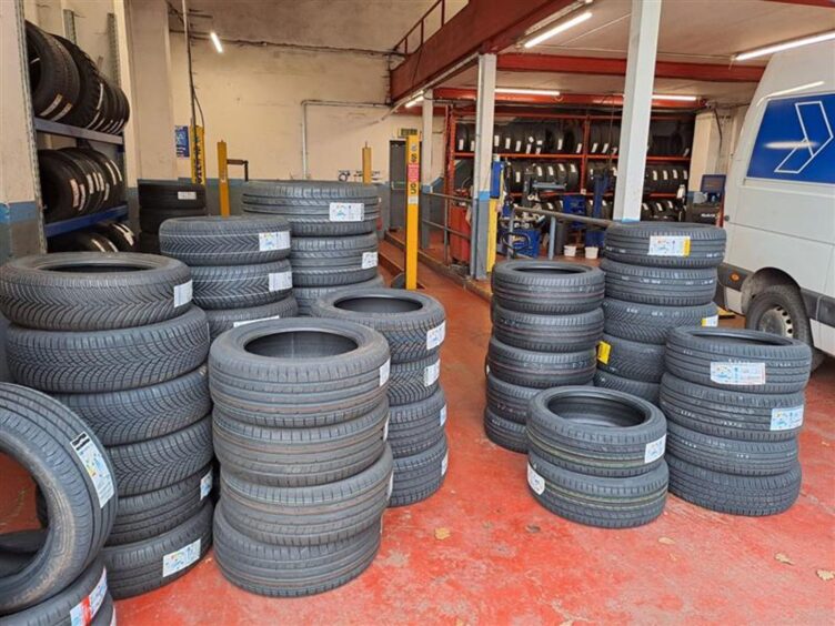 Stacks of tyres at Inverness Kwik Fit 