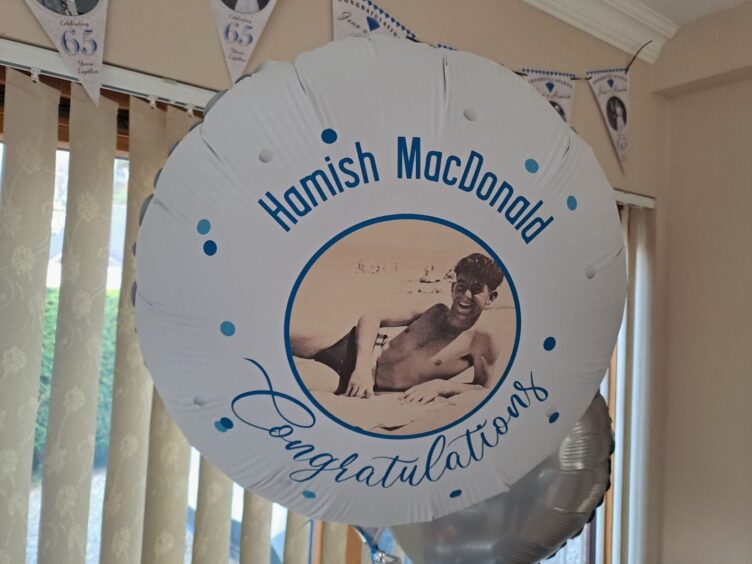 balloon of Hamish with a photo of him when he was younger