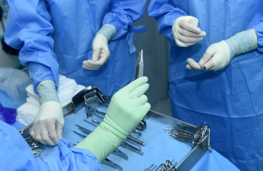 A surgical team preparing a theatre room at Aberdeen Royal Infirmary, where some operations have been put on hold. Image: Darrell Benns/DC Thomson